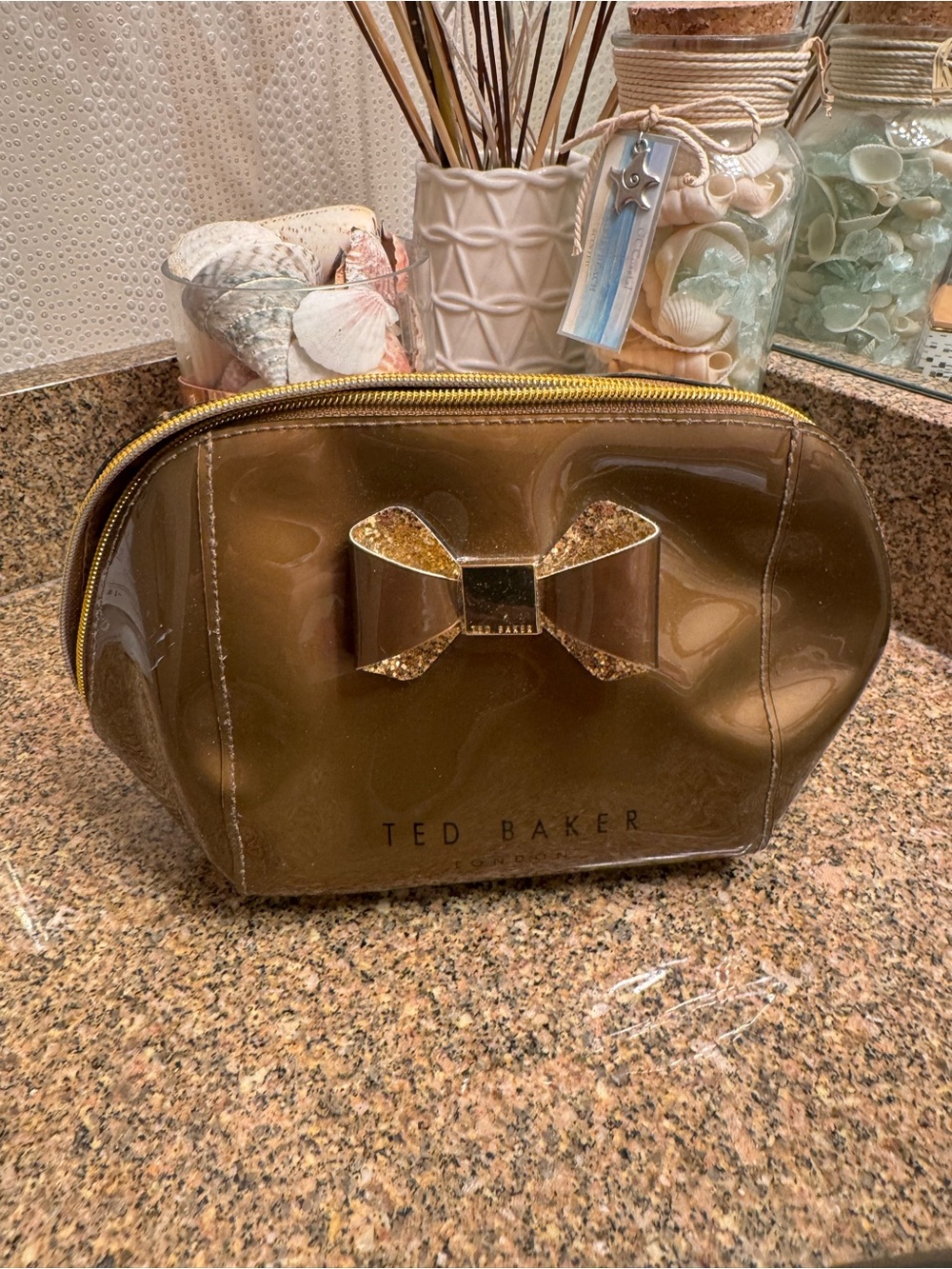 Ted Baker Brown Glossy Bronze Cosmetic Pouch with Glitter Bow Accent